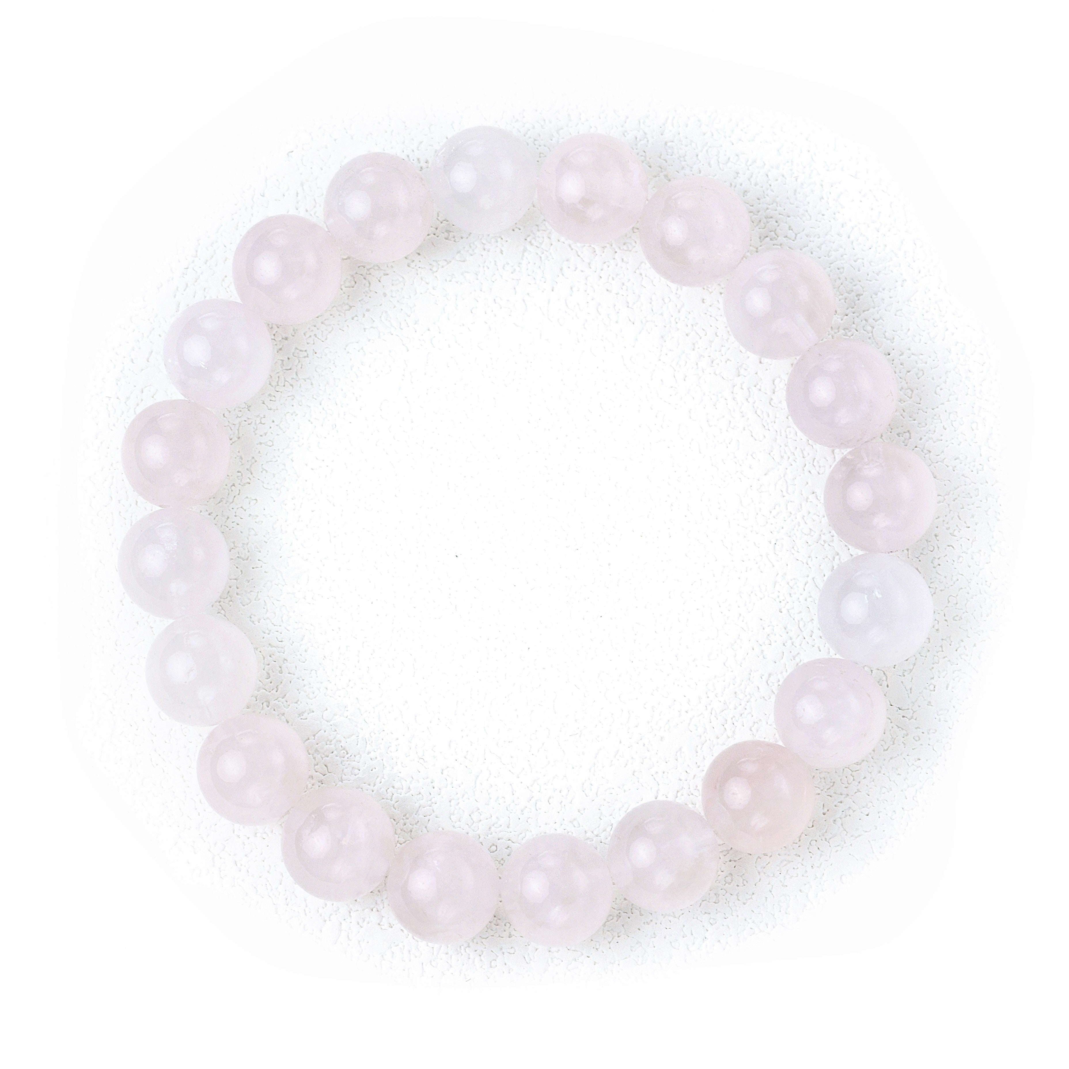 Liminéra Glow Mozambique Rose Quartz bracelet, showcasing its gentle soft pink hues and natural cloud-like internal textures.