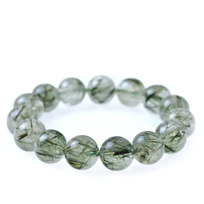 Detail view of the Liminéra Verdant bracelet, showcasing the natural textures of minimalist Green Rutilated Quartz for career focus and quiet luxury.