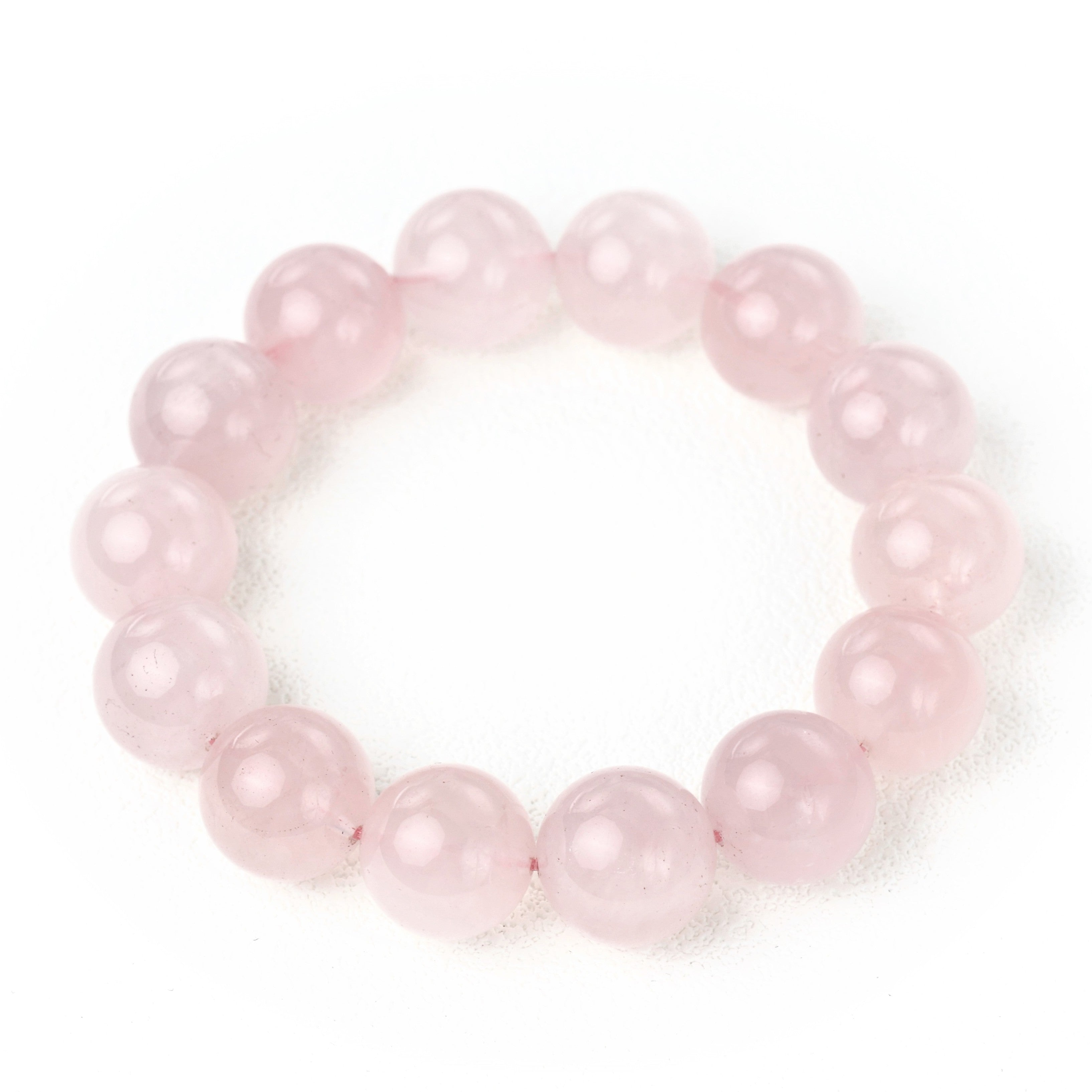 Detailed view of the Liminéra Jelly bracelet, highlighting the soft, unhurried rhythm and the smooth texture of minimalist high-quality Rose Quartz.