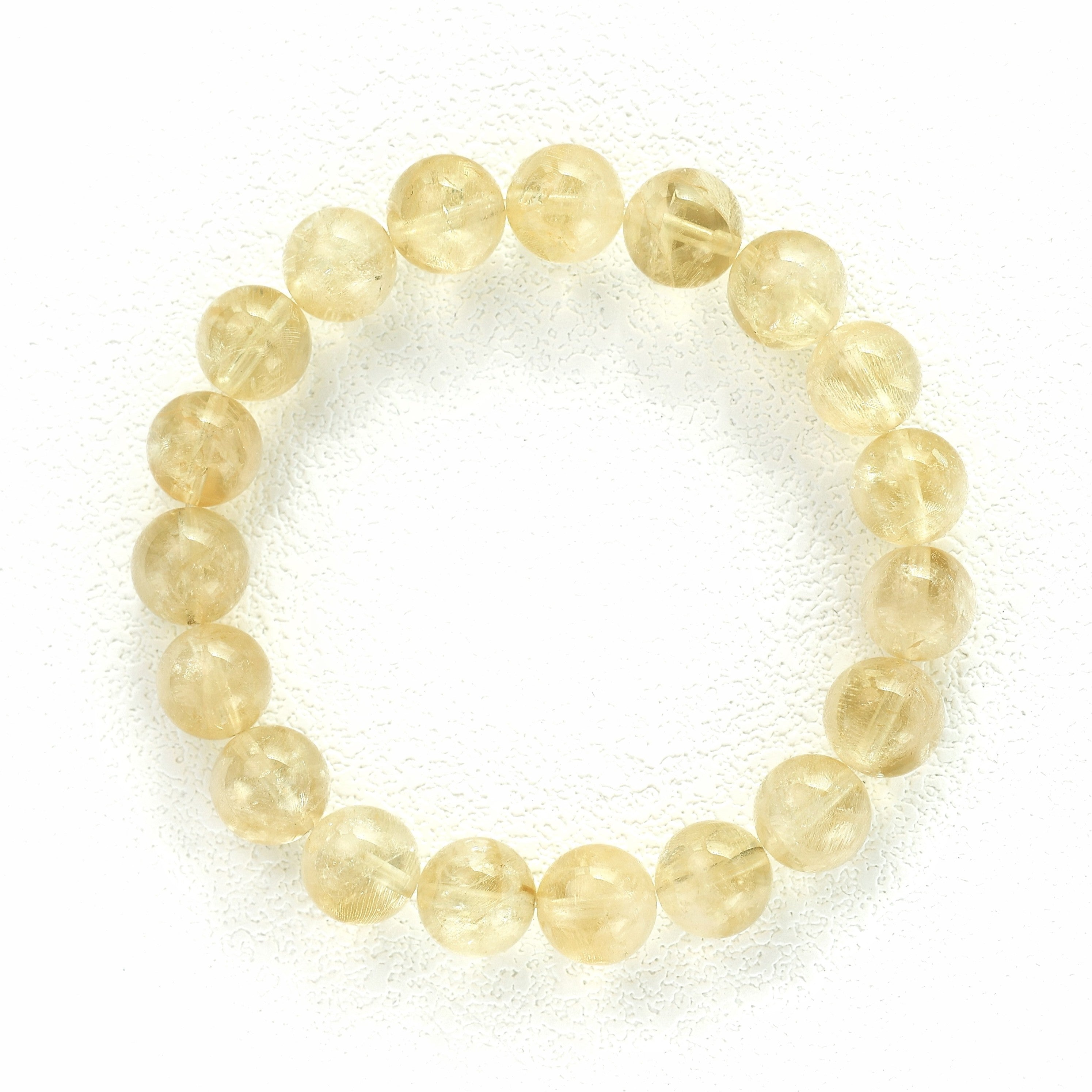 Liminéra Harvest Citrine bracelet, showcasing its honeyed translucency and warm, earthy golden tones interwoven with natural internal clouds.