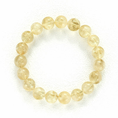 Liminéra Harvest Citrine bracelet, showcasing its honeyed translucency and warm, earthy golden tones interwoven with natural internal clouds.