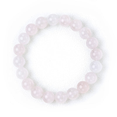 Liminéra Glow Mozambique Rose Quartz bracelet, showcasing its gentle soft pink hues and natural cloud-like internal textures.