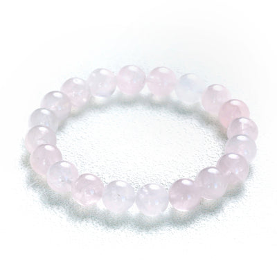 Detailed perspective of the Liminéra Glow bracelet, highlighting the comforting energy and softly diffused light within the pink crystal beads.