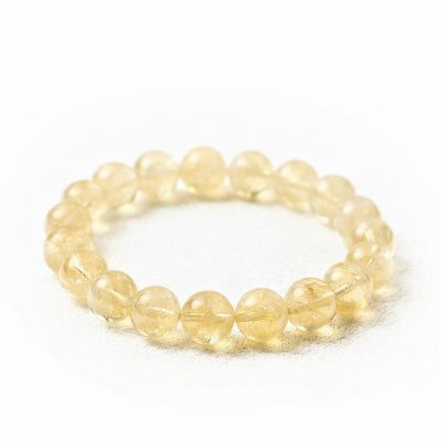 Detailed perspective of the Liminéra Harvest bracelet, highlighting the steady stream of warmth and grounding energy of minimalist Citrine.