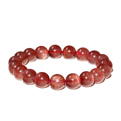 Detailed view of the Liminéra Strawberry Quartz bracelet, showcasing the suspended sparkling mineral flecks and its awakening energy.