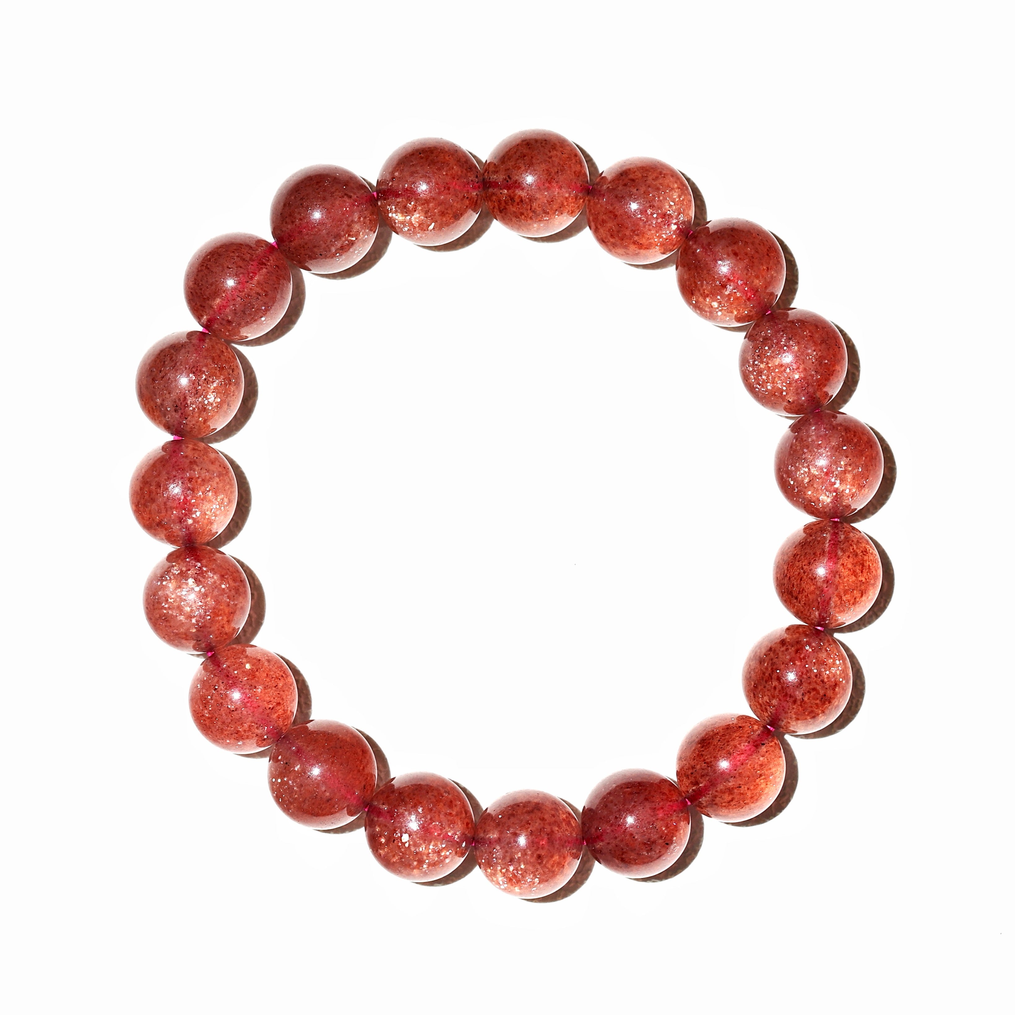 Liminéra vibrant Strawberry Quartz bracelet, featuring a translucent deep red base and a mesmerizing sparkling aventurescence effect.